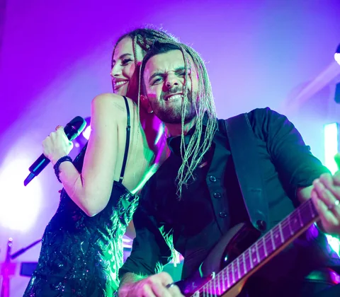 The Gloves singer and guitarist performing back to back under purple lights