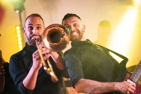 The Gloves trombonist and bassist performing side by side